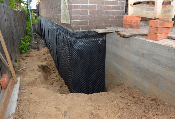 Happy homeowners after waterproofing job in Milladore
